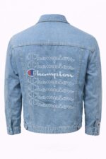 light wash denim jacket featuring embroidered Champion brand logos. - Image 2